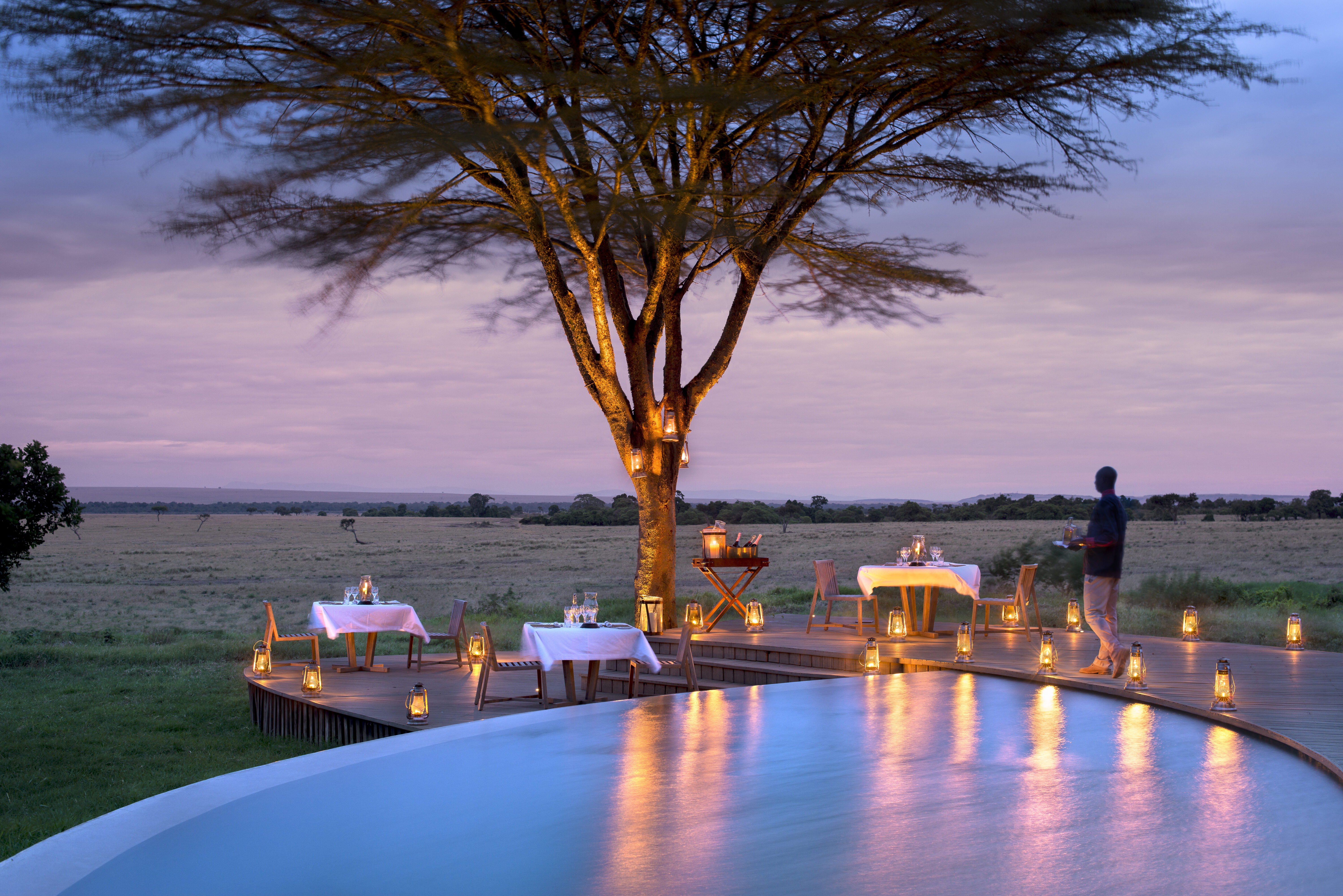 Kenya-Bateleur-camp-South-Guest-area-pool-dinner-with-lanterns-and-butler